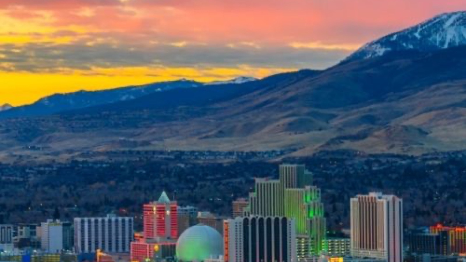 Upscale Reno foothill neighborhood with contemporary homes and Sierra Nevada mountain views at golden hour